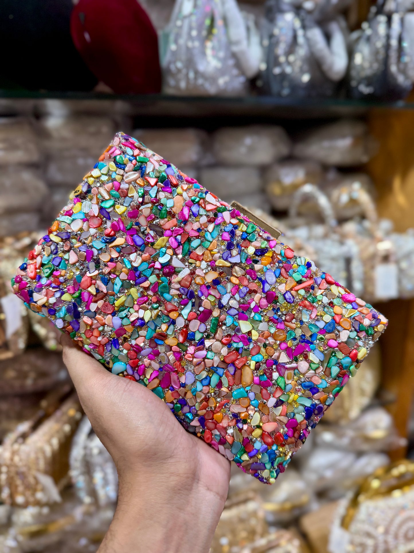 Sea stone worked classy party clutch.
