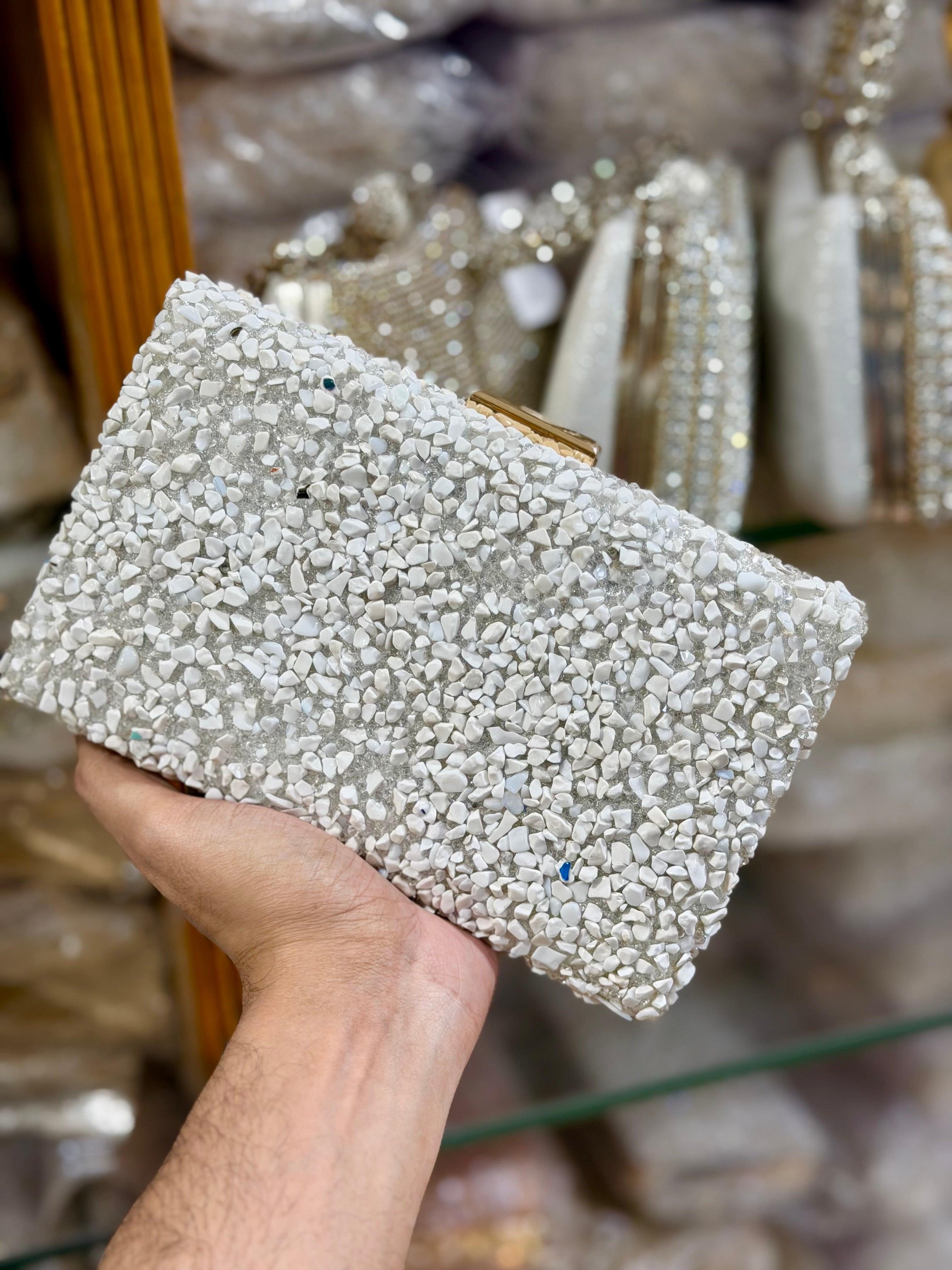 Sea stone worked classy party clutch.