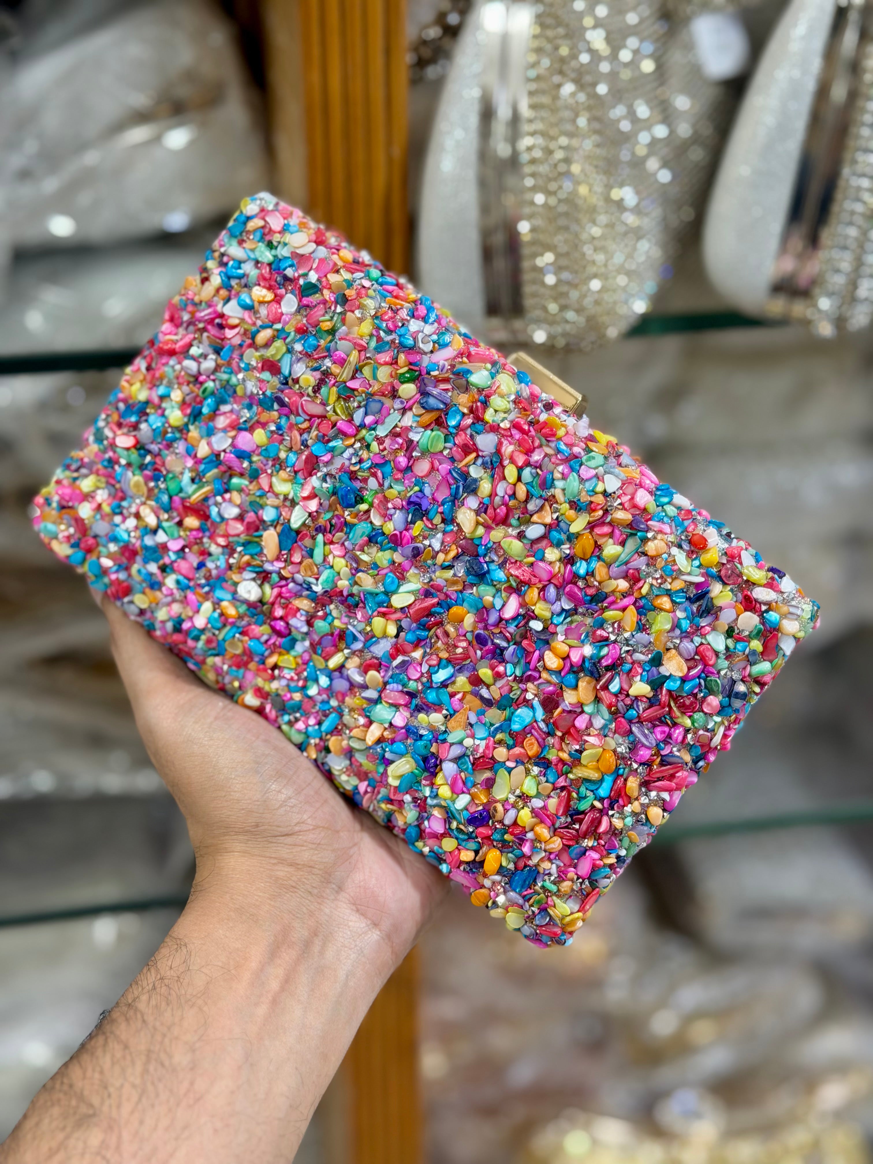 Sea stone worked classy party clutch.