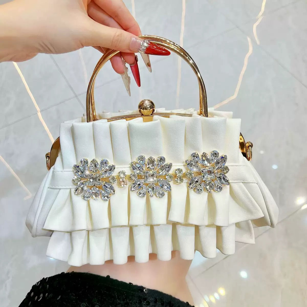 Fashionable and beautiful looking party hand purse available.
