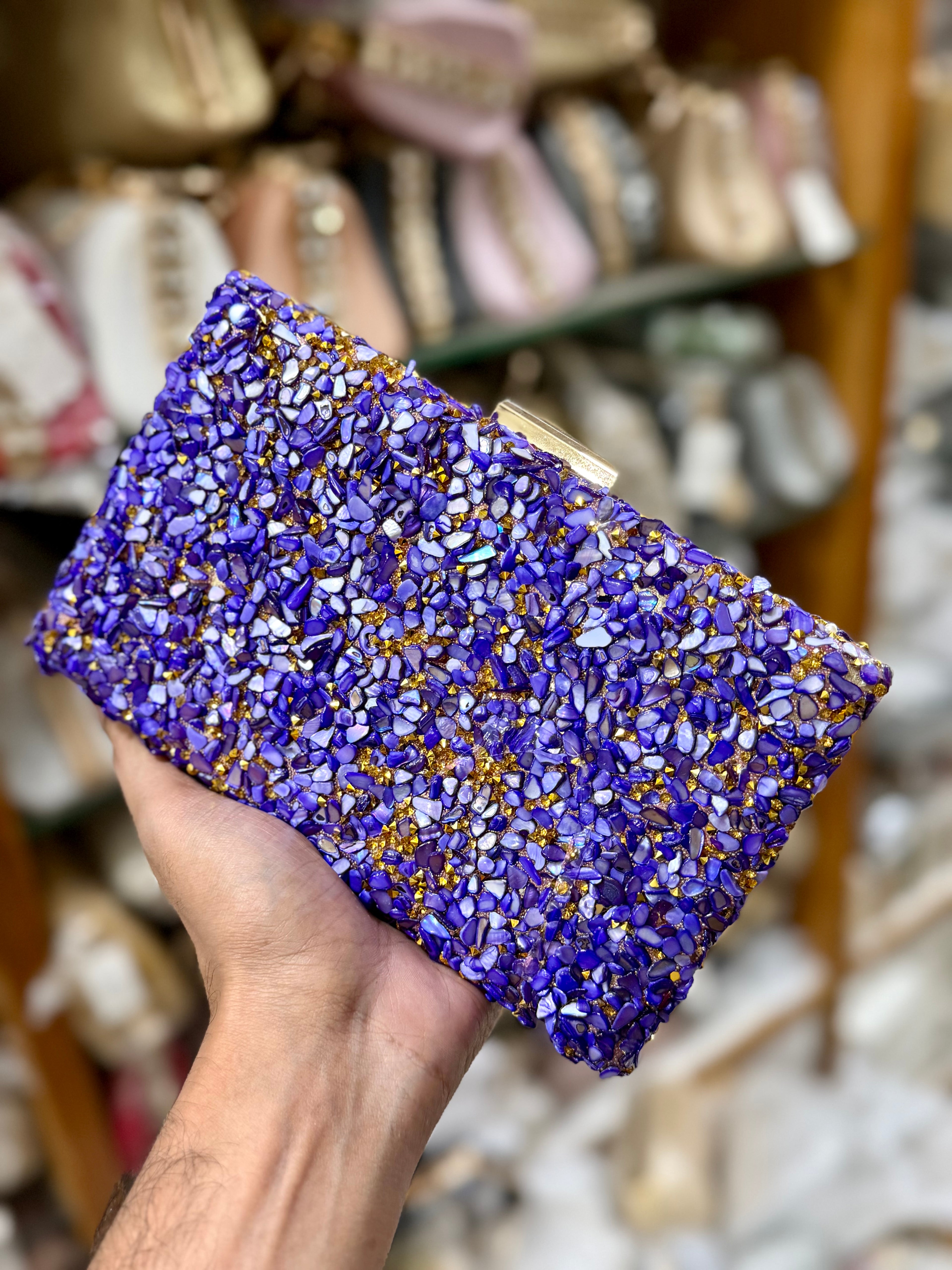 Sea stone worked classy party clutch.