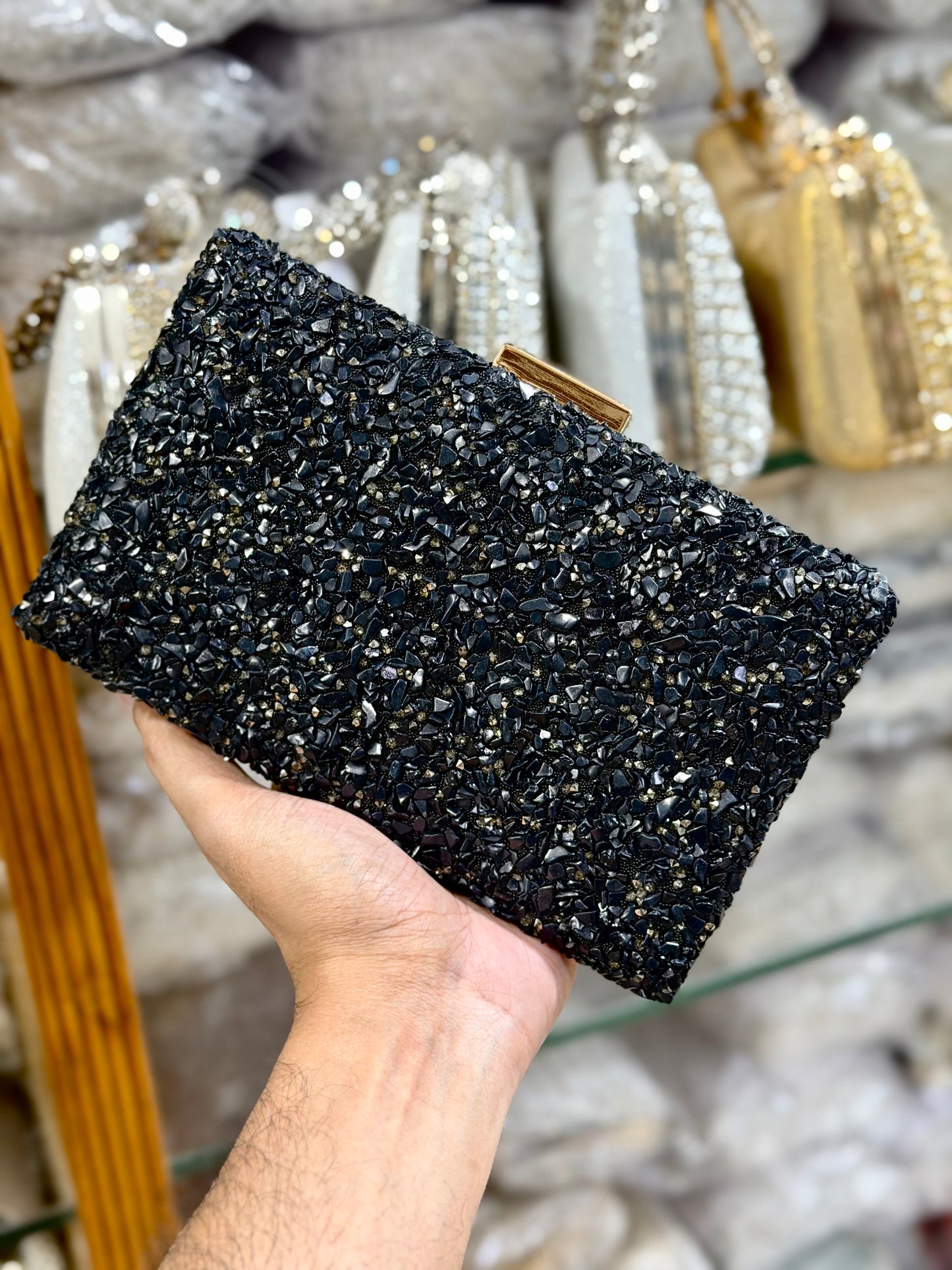 Sea stone worked classy party clutch.