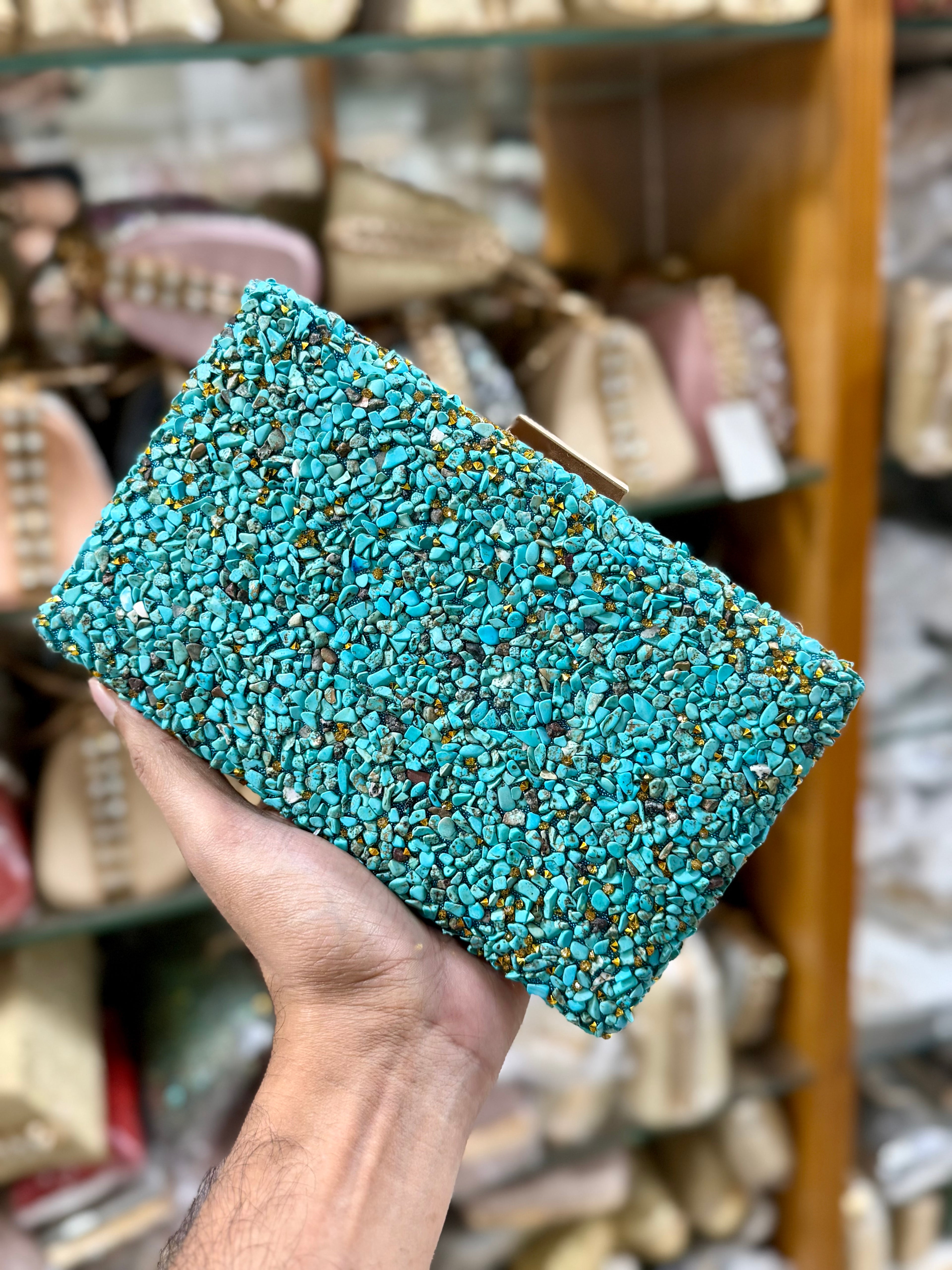 Sea stone worked classy party clutch.