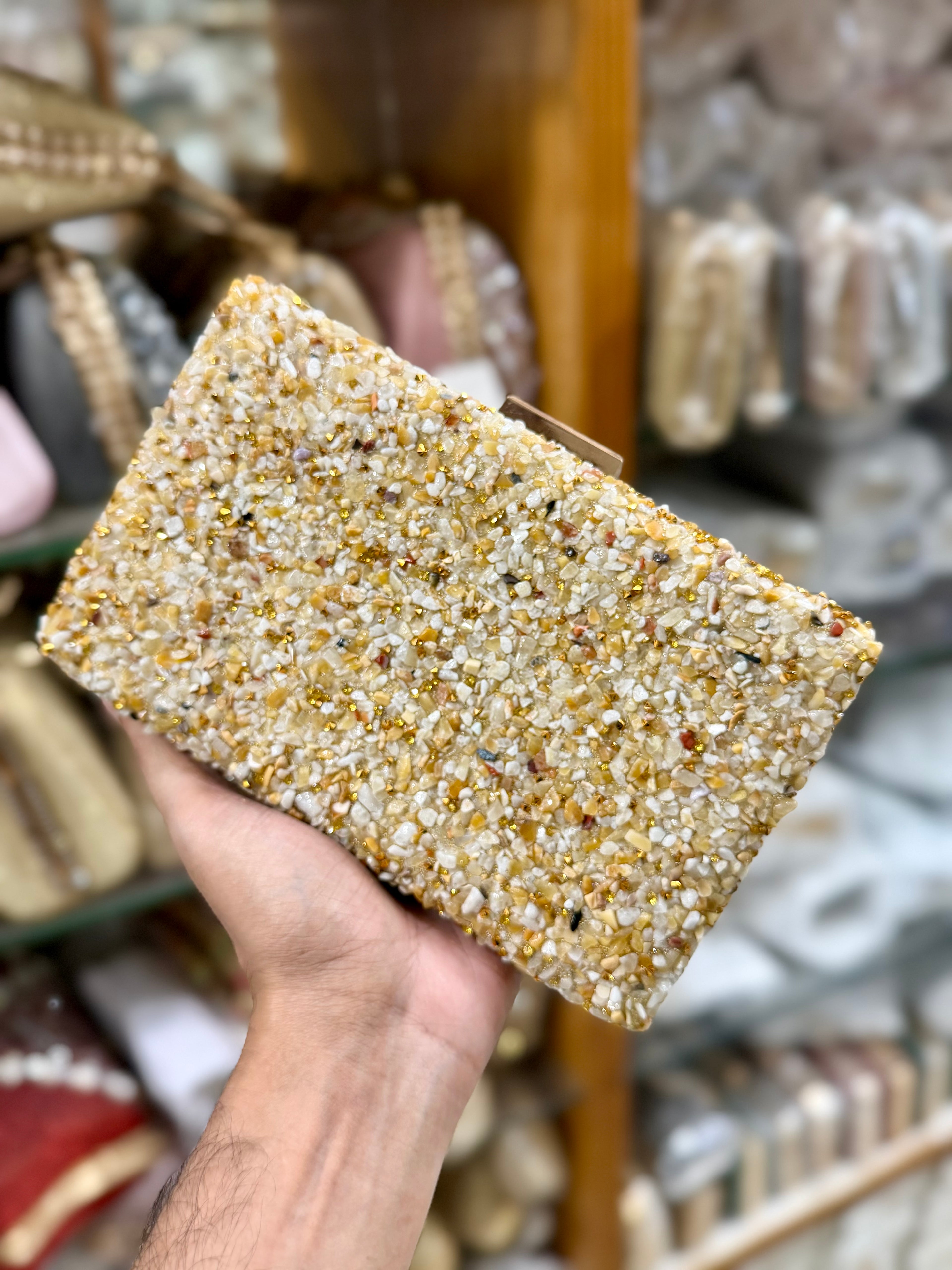 Sea stone worked classy party clutch.