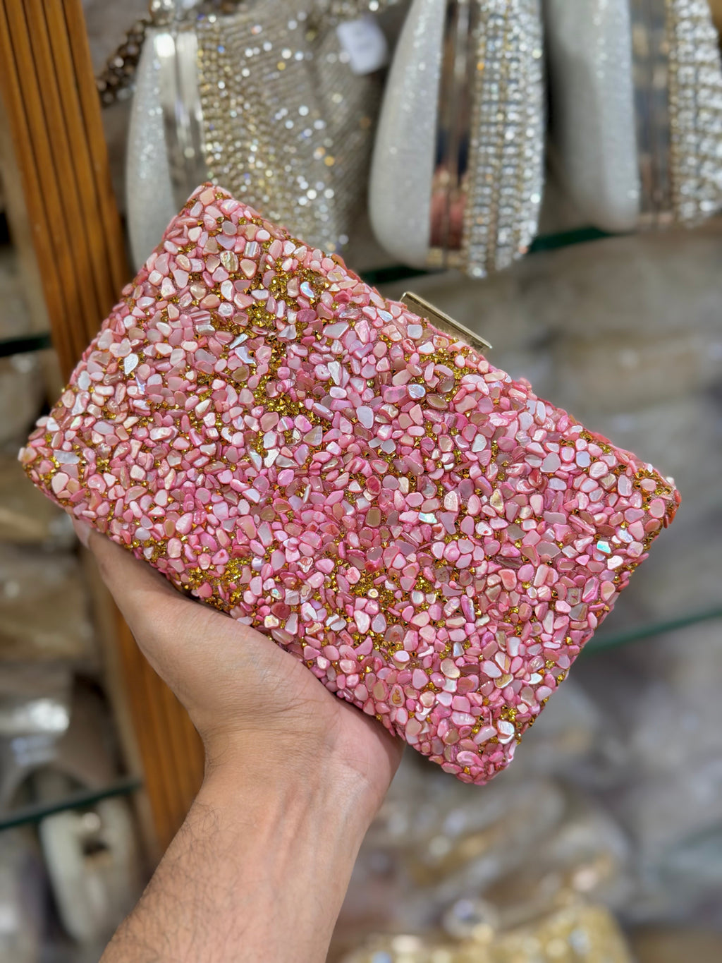 Sea stone worked classy party clutch.