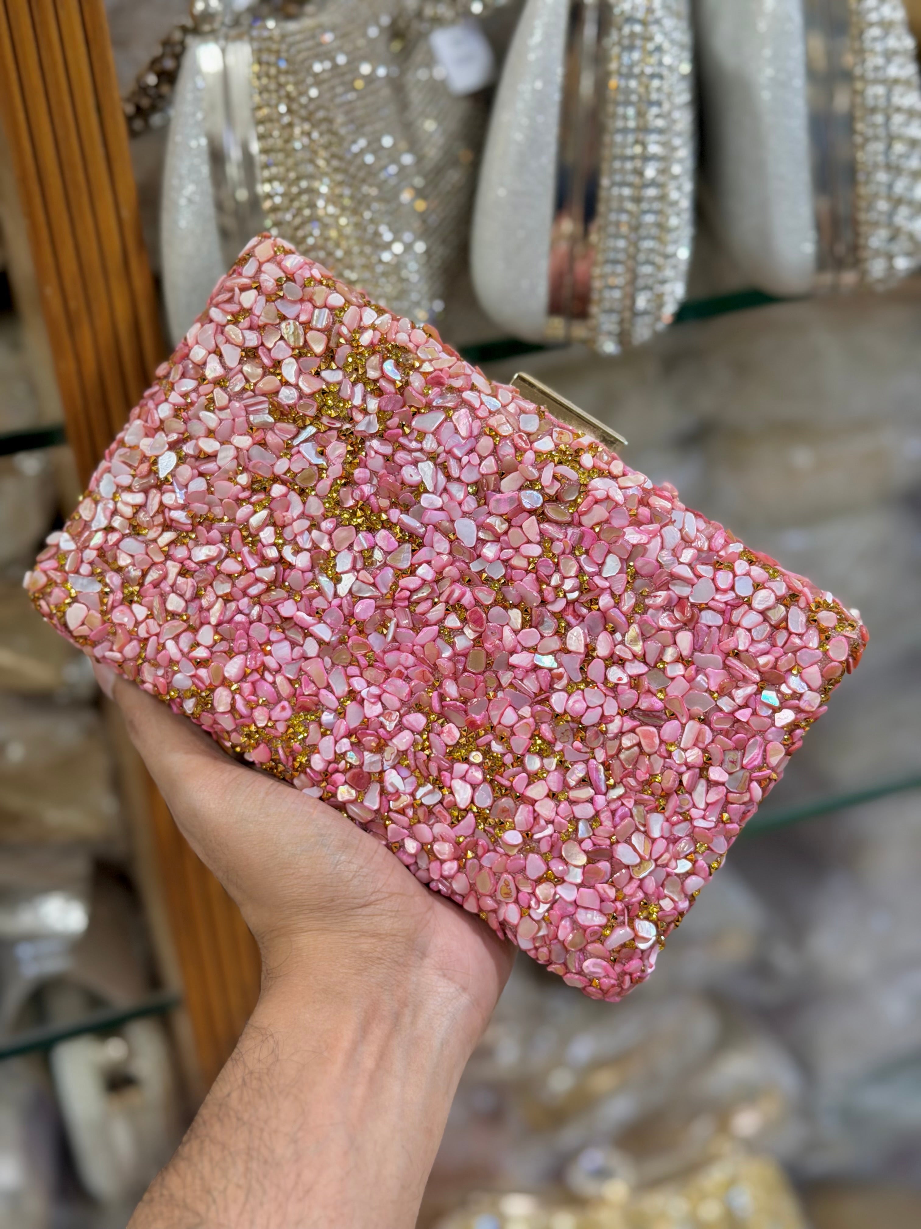 Sea stone worked classy party clutch.