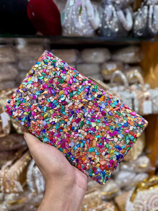 Sea stone worked classy party clutch.
