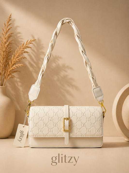 fashionable shoulder bag with twisted short belt and long strap.